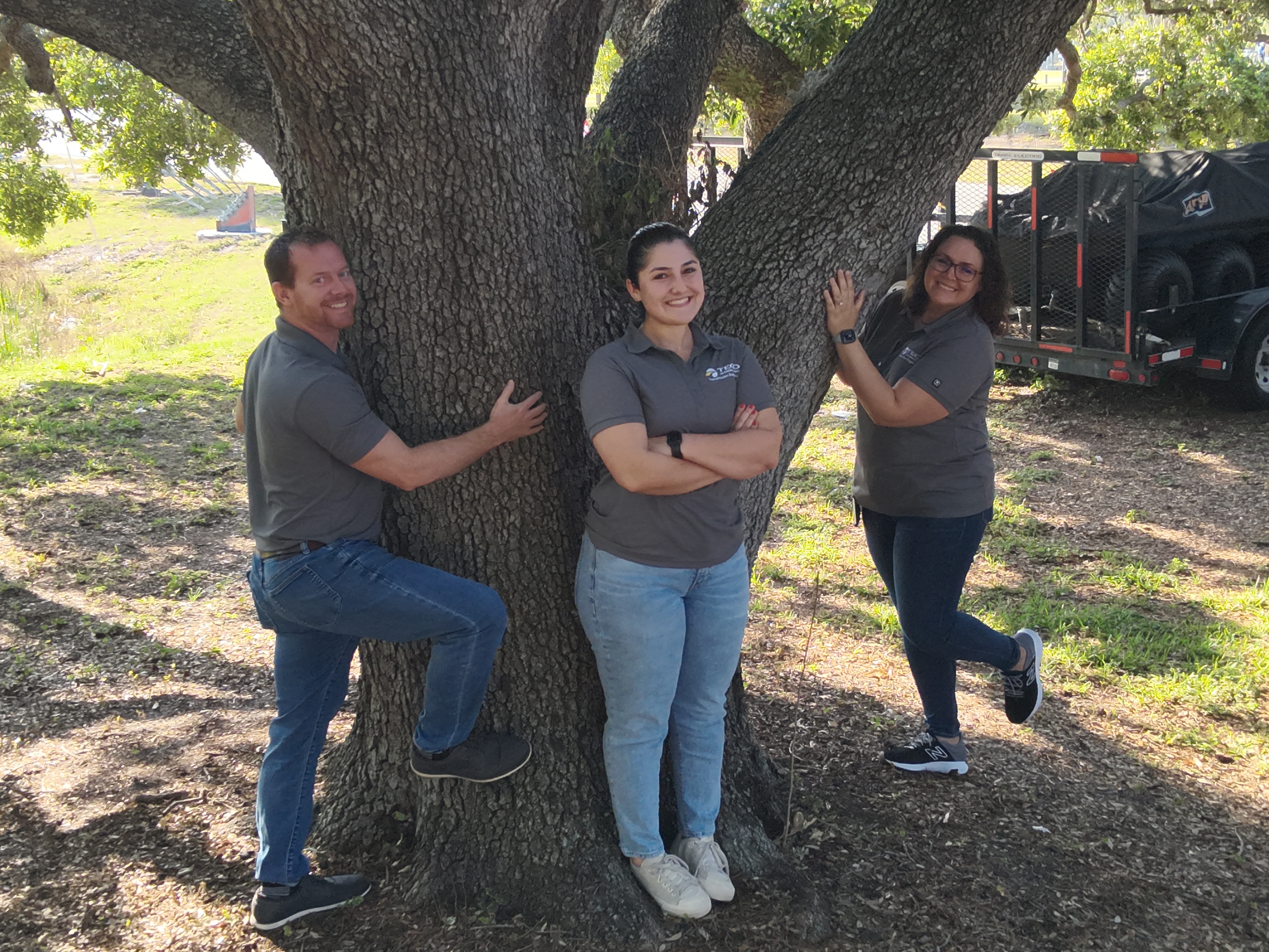 One of our Transmission Operations drones caught Kylie Cordova (middle) and her tree-hugging teammates all smiles.
