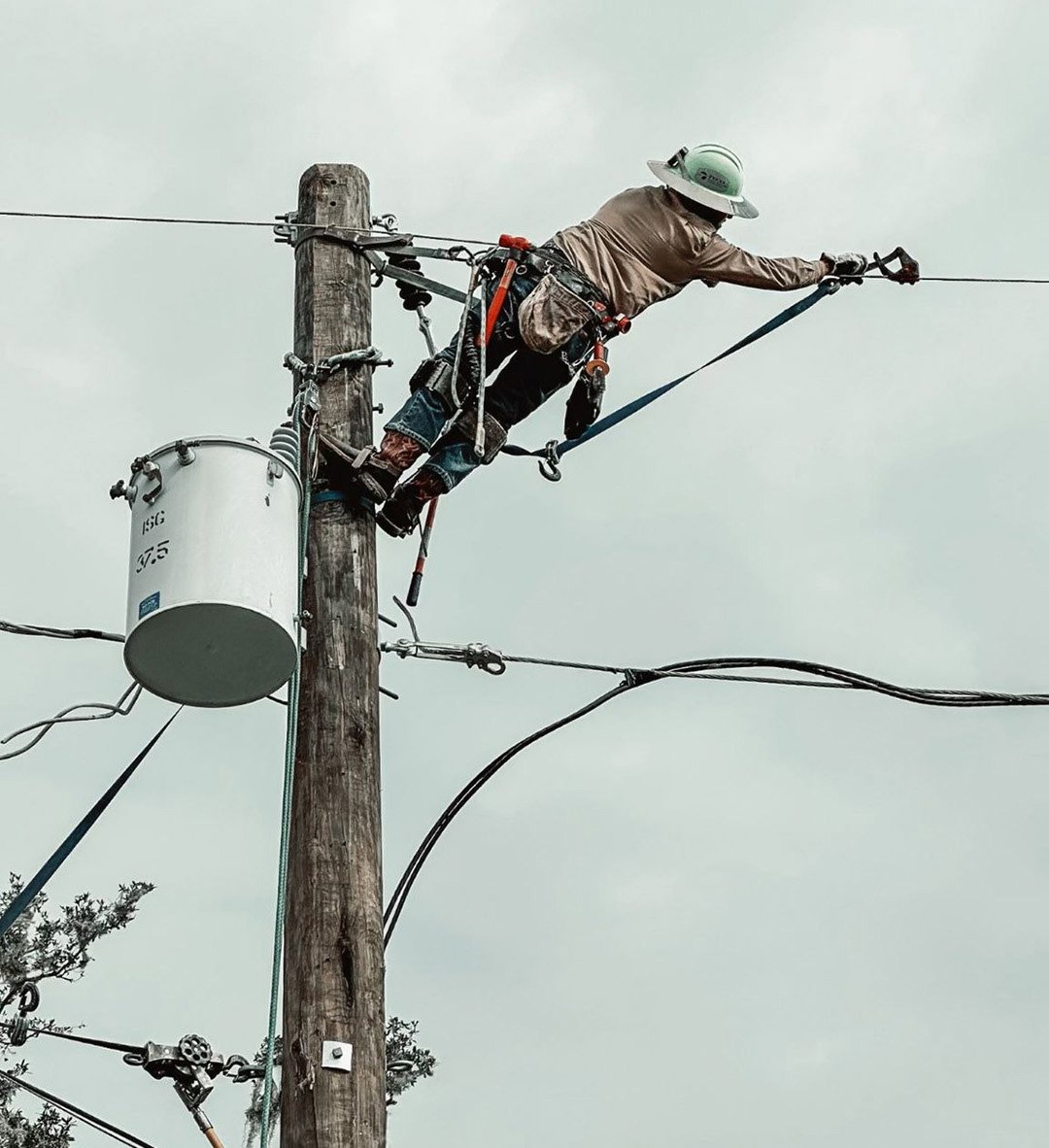 Hurricane Milton Lineman Reaching